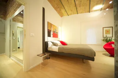 a bedroom with a bed and a mirror at Fico Blu in Rome