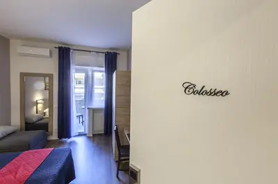 a bedroom with a bed and a living room at La Palma in Rome