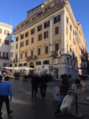 a group of people walking in front of a building at Angel Spagna Suite in Rome