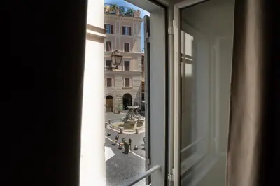 a view of a city from a window at Kame Hall in Rome