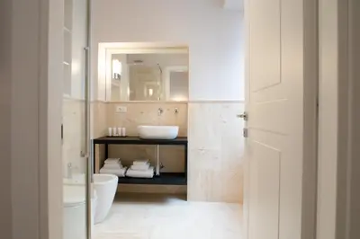 a bathroom with a sink and a toilet at Kame Hall in Rome