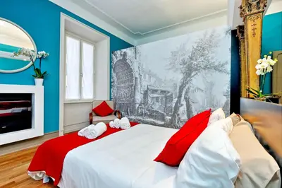 a bedroom with a bed with two stuffed animals on it at Piranesi Charmsuite in Rome