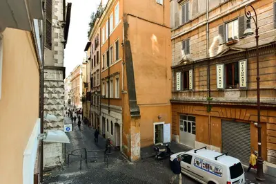 an alley with a white van parked in front of buildings at Loft Pantheon in Rome