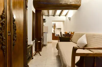a living room with a couch and a table at Loft Pantheon in Rome