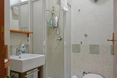 a bathroom with a sink and a shower at Elion in Rome