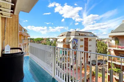 a view from the balcony of a hotel with a swimming pool at Oksana's Bernadette Apartment in Rome