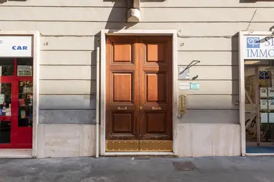 a wooden door on the side of a building at NOH Family Nest in Rome