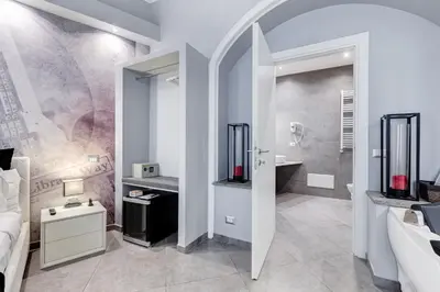 a bathroom with a shower and a sink and a toilet at Maison Degli Artisti Suites in Rome