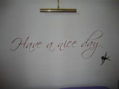 a wall with a sign that reads have a nice day at MGPgroup Have a Nice Day in Rome