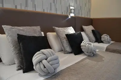 a couch with pillows on top of it at At your Place in Rome