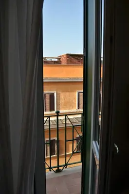 an open window with a view of a balcony at At your Place in Rome