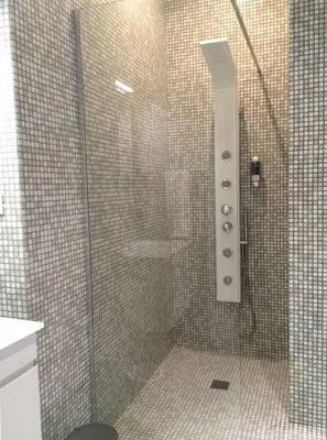 a shower with a glass door in a bathroom at Tuttelestrade - The apartment in Rome