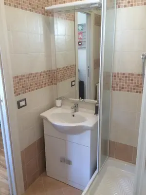 a bathroom with a sink and a shower at La casa per te in Rome
