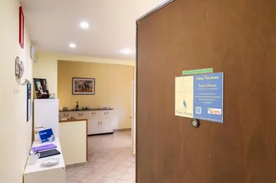 a door in a kitchen with a sign on it at TOM'S HOUSE in Rome