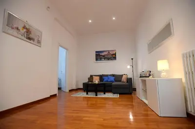 a living room with a couch and a table at Big House Colosseum in Rome