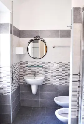 a bathroom with two sinks and a mirror at 