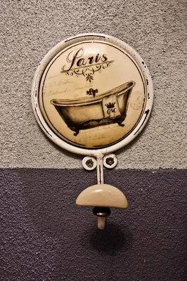 a sign on a wall with a boat on it at LM Suites Spagna in Rome