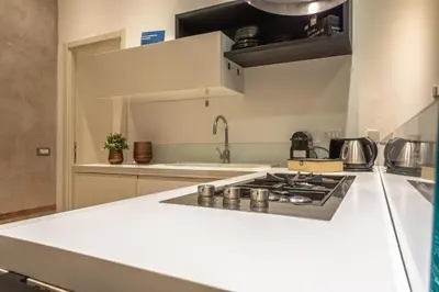 a kitchen with a stove and a counter top at Private Apartment Colosseum in Rome