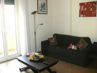 a living room with a couch and a coffee table at Magnifico Cozy Apartment 400m da metroB in Rome