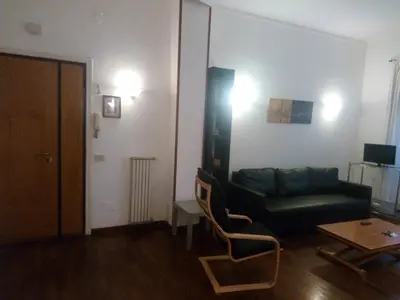 a living room with a couch and a table at La Casa di Nonna Betta in Rome