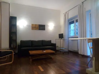 a living room with a couch and a coffee table at La Casa di Nonna Betta in Rome
