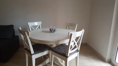 a white table and chairs with a bowl on it at C'è posto per te in Rome