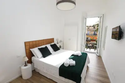 a bedroom with a bed with two towels on it at Vatican Garden Rooms in Rome
