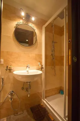 a bathroom with a sink and a shower at Underground Rome's Room in Rome