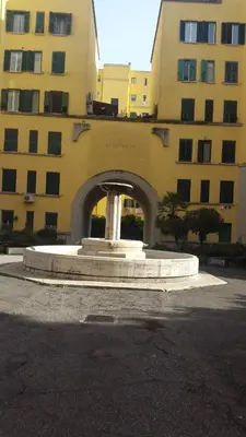 a building with a fountain in front of a building at Underground Rome's Room in Rome