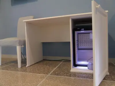 a cabinet with a tv inside of it with a chair at 325 Rooms ai Fori in Rome