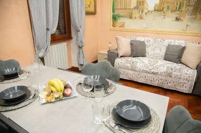 a living room with a table with plates of food at ROMA18 in Rome