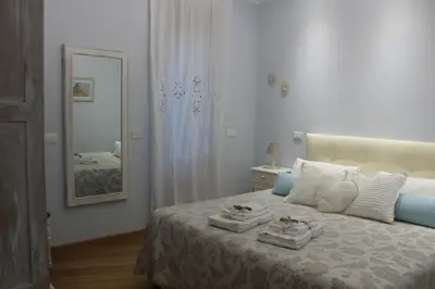 a bedroom with a bed with two towels on it at La Cupola Suite in Rome