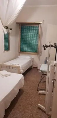 a hospital room with two beds and a window at Lorenzo Magnifico Apartment in Rome