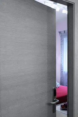 a door with a mirror in a room at Arcadia Domus in Rome