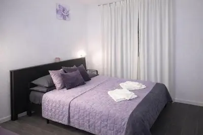 a bedroom with a bed with two towels on it at Saint Peter Basilica 200m- 2BR -2BA -Sleeps 6 in Rome