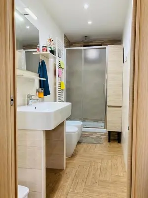 a bathroom with a sink and a toilet and a shower at Villino Marcella in Rome