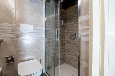 a bathroom with a shower with a toilet at Casa Trasteverina in Rome