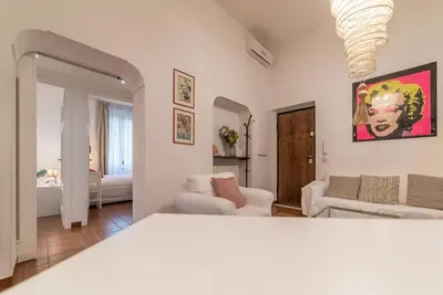 a living room with a couch and a living room at Vatican Luxury Terrace in Rome