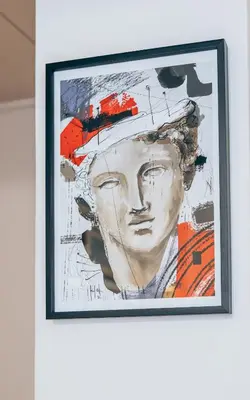 a painting of a woman with a hat on a wall at Restart Accommodations Farnesina in Rome