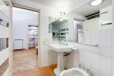 a bathroom with a sink and a toilet at VENETO COMFORTABLE Apartment in Rome