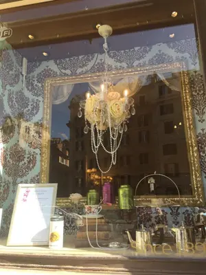 a chandelier in the window of a store at VENETO COMFORTABLE Apartment in Rome