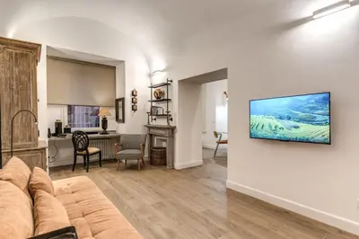 a living room with a couch and a desk at Casa Alessandra in Rome