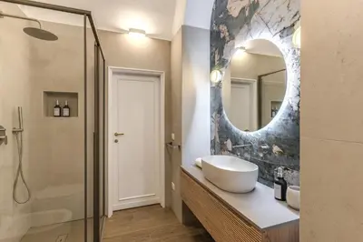 a bathroom with a sink and a mirror at Casa Alessandra in Rome