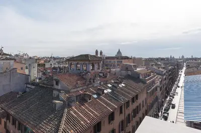 an aerial view of a city with buildings at Paradiso Penthouse - FromHometoRome in Rome