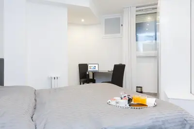 a bedroom with a bed with a tray of food on it at Domus Arena in Rome