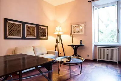 a living room with a couch and a table at Porta Latina Apartment in Rome