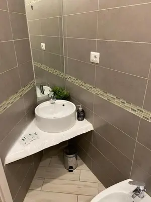 a bathroom with a sink and a toilet at Sweet Sleep Vatican in Rome