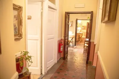 a hallway with a door leading to a room at Residenza Maritti Classic Rooms - Guesthouse in Rome