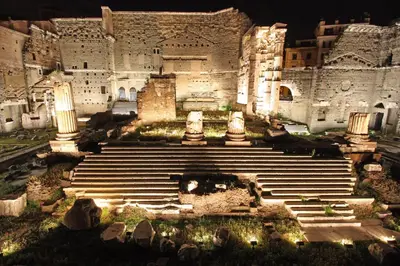 a large building with stairs in front of it at night at Residenza Maritti Classic Rooms - Guesthouse in Rome