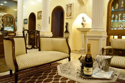 a room with a bottle of champagne on a table at Guesthouse Borromeo Roma in Rome